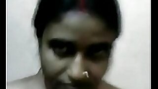 Indian aunt strips and gives a sensual blowjob in this steamy video.